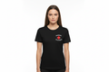 Woman wearing black t-shirt with red medical cross on left chest